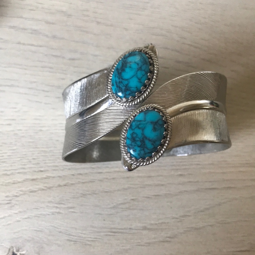 Silver toned cuff bracelet with turquoise stones